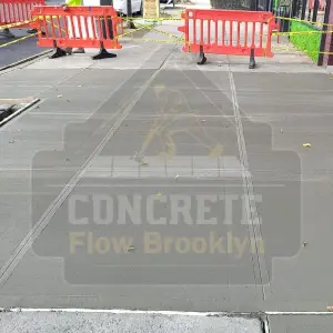 New residential sidewalk slabs curing behind safety barricades